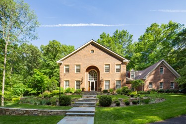 Front entrance of a house with stone walkway.