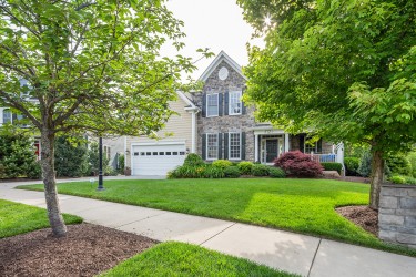 front lawn with house and shrub garden